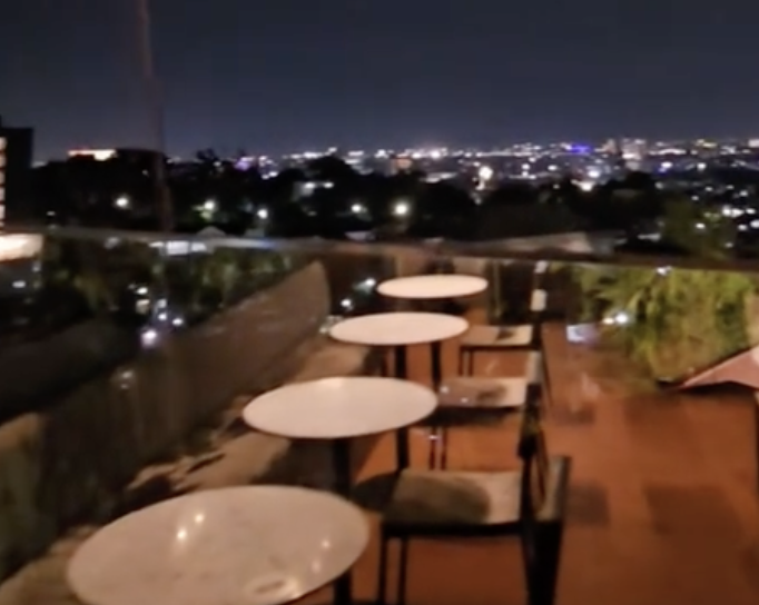 Pelangi Tambora rooftop at night, Semarang city lights below